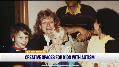 A joyful family moment with children and adults gathered closely indoors.
