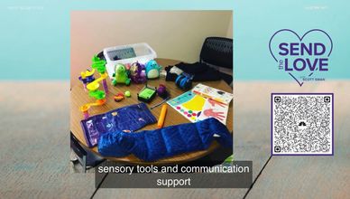 A table with sensory tools and communication support materials for therapy.