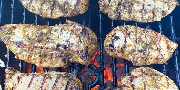 Grilled chicken on a hot grill