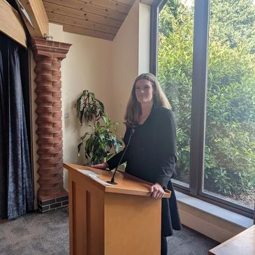 Photograph of Nicola Jackson a non-religious celebrant officiating a funeral at a crematorium.