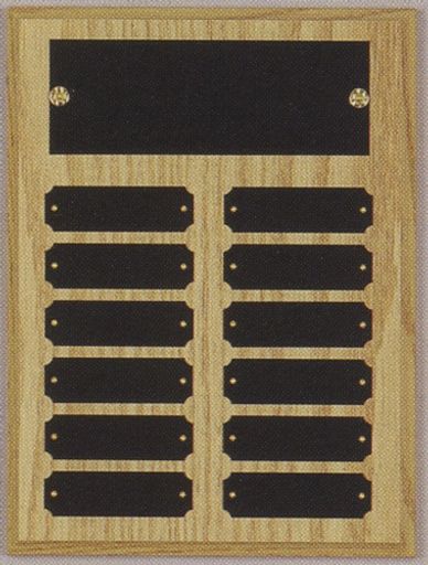 Wooden plaque with blank black nameplates for awards or recognition.