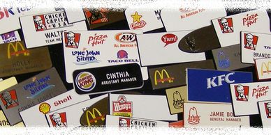 A collection of fast-food name tags from various brands.