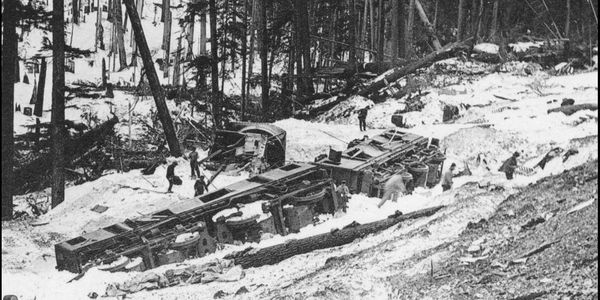 Rescue workers search for victims of the 1910 Great Northern Railway avalanche disaster.
