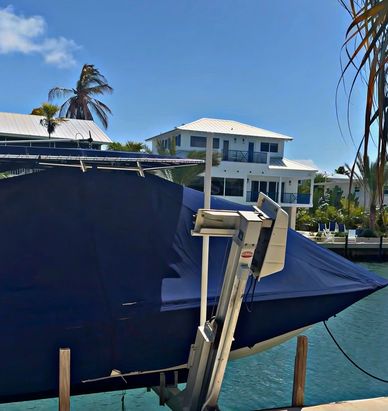 Ceramic coated boat that is covered and ready for summer storage in Islamorada, FL | Venetian  Shore