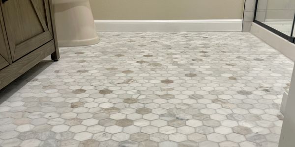 Bathroom renovation, full home renovation, insurance claim job with white tile flooring.