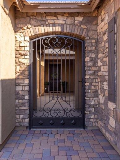 Pavers, decorative gates, stone veneer siding. 