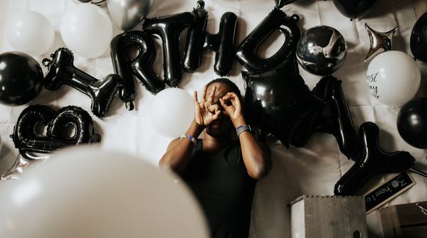 Black and white balloon photoshoot for a birthday celebration. 