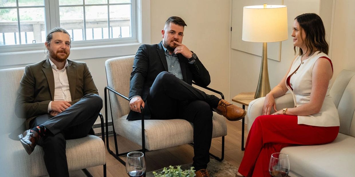 A group of 3 real estate agents in a listing they are going to post for sale in St. John’s.