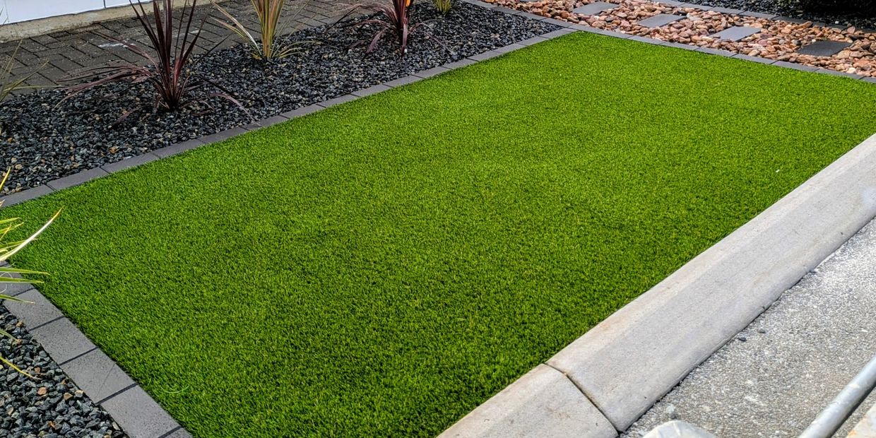 Artificial turf installation in Adelaide with landscaping and paving
