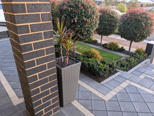 charcoal concrete pavers with matching step installation with landscaping in Adelaide