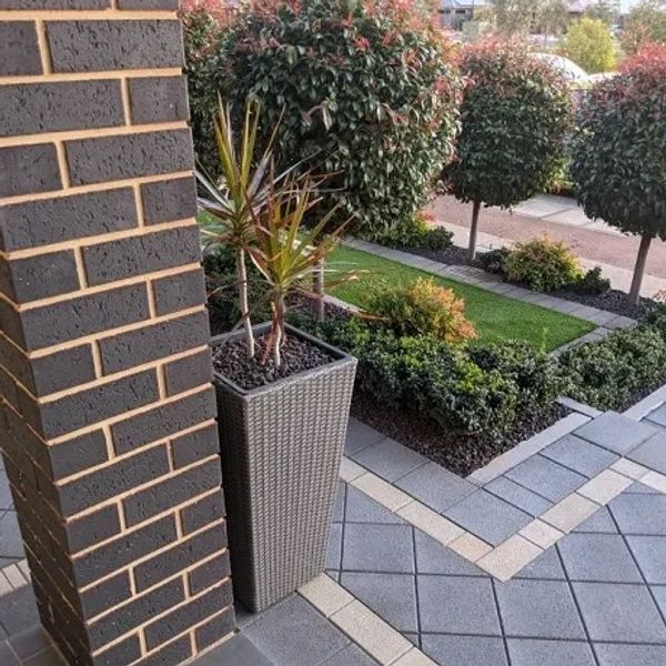 Driveway paving and perimeter paving with retaining wall and landscaping at Blakeview