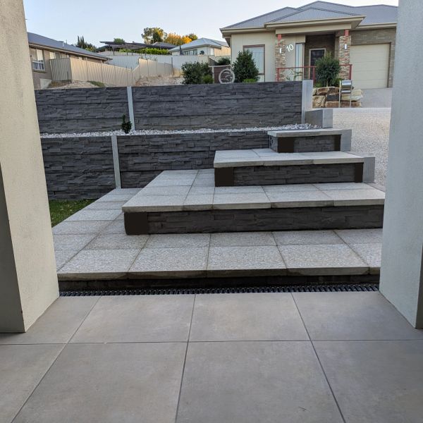 retaining wall with steps concrete sleepers and stone pavers in Adelaide