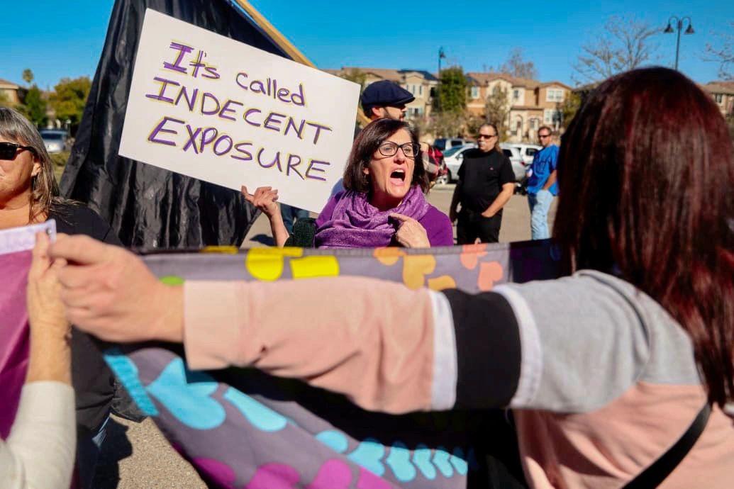 People attend a rally at the Cameron Family YMCA in Santee, CA