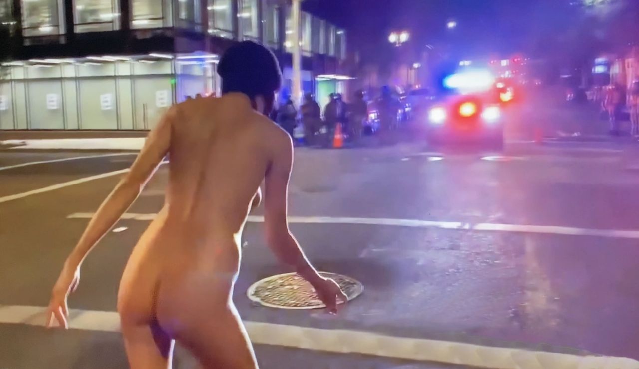 Video (see next ClothesFree TV Show) shows the woman pacing on the sidewalk, before taking a seat and doing some naked yoga and ballet poses.