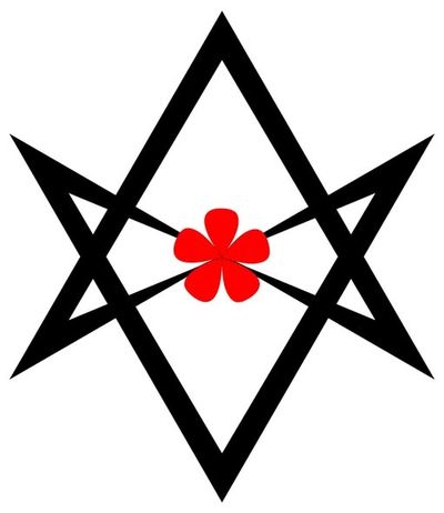 Black geometric star shape with a red four-leaf clover in the center.