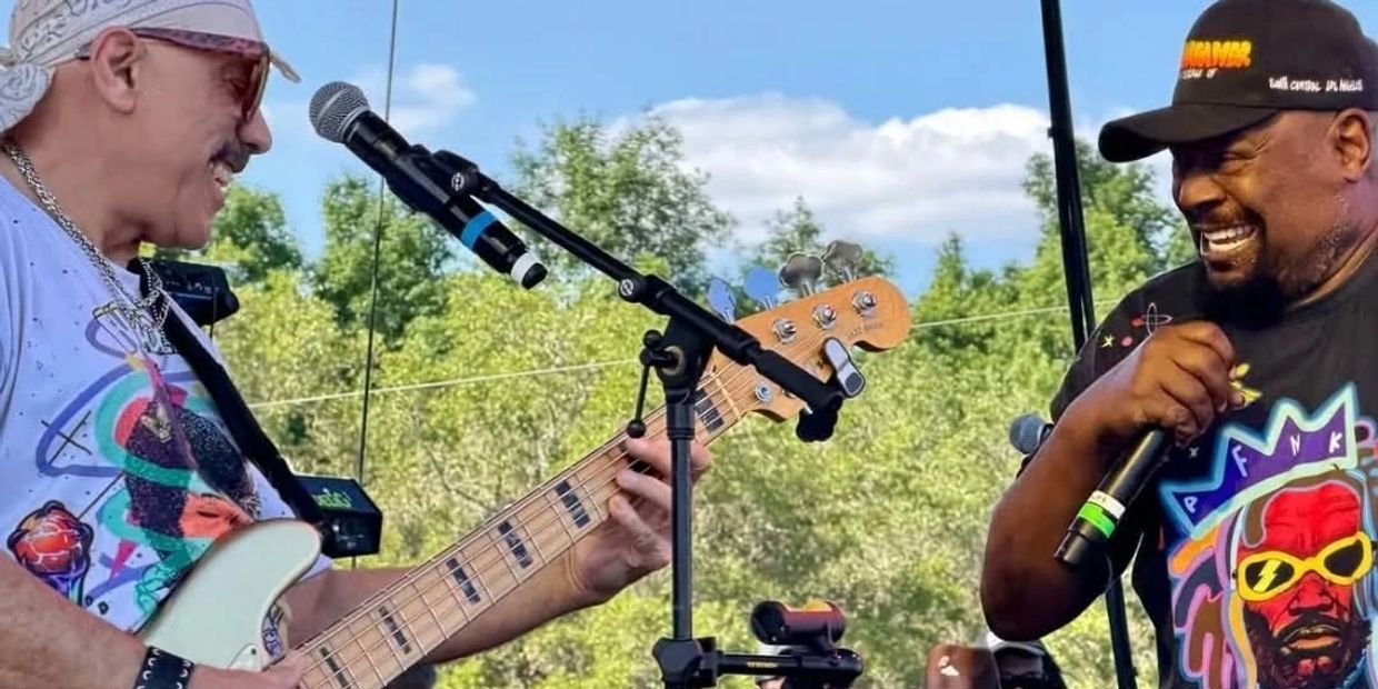 Two musicians joyfully perform outdoors, one playing guitar and the other singing.
