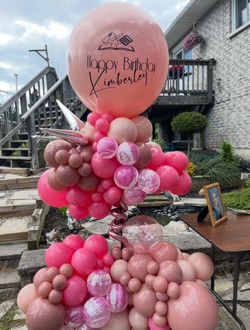 Colorful balloon arrangement with a birthday message for Kimberley.
