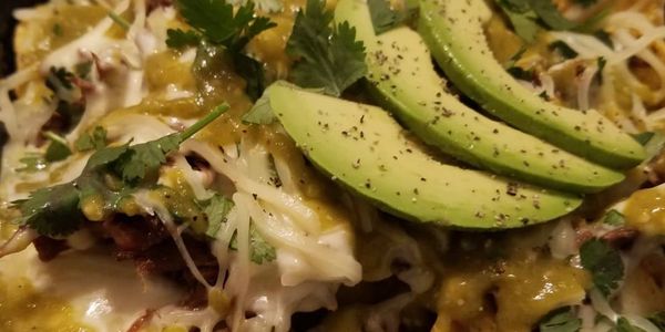 Issachar Gourmet Nachos 
Seasoned shredded beef/ chicken with roasted tomatillos and Anaheim Chilies