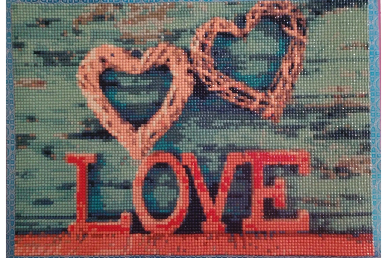 Heart-shaped decorations with the word LOVE in red.