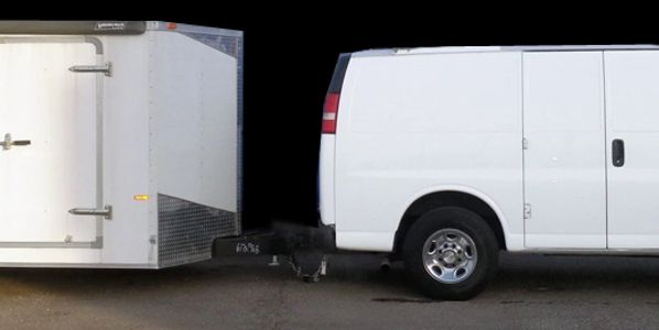 A White Cargo Van with a white trailer