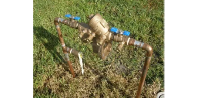 Reduced pressure zone backflow preventer connected to irrigation