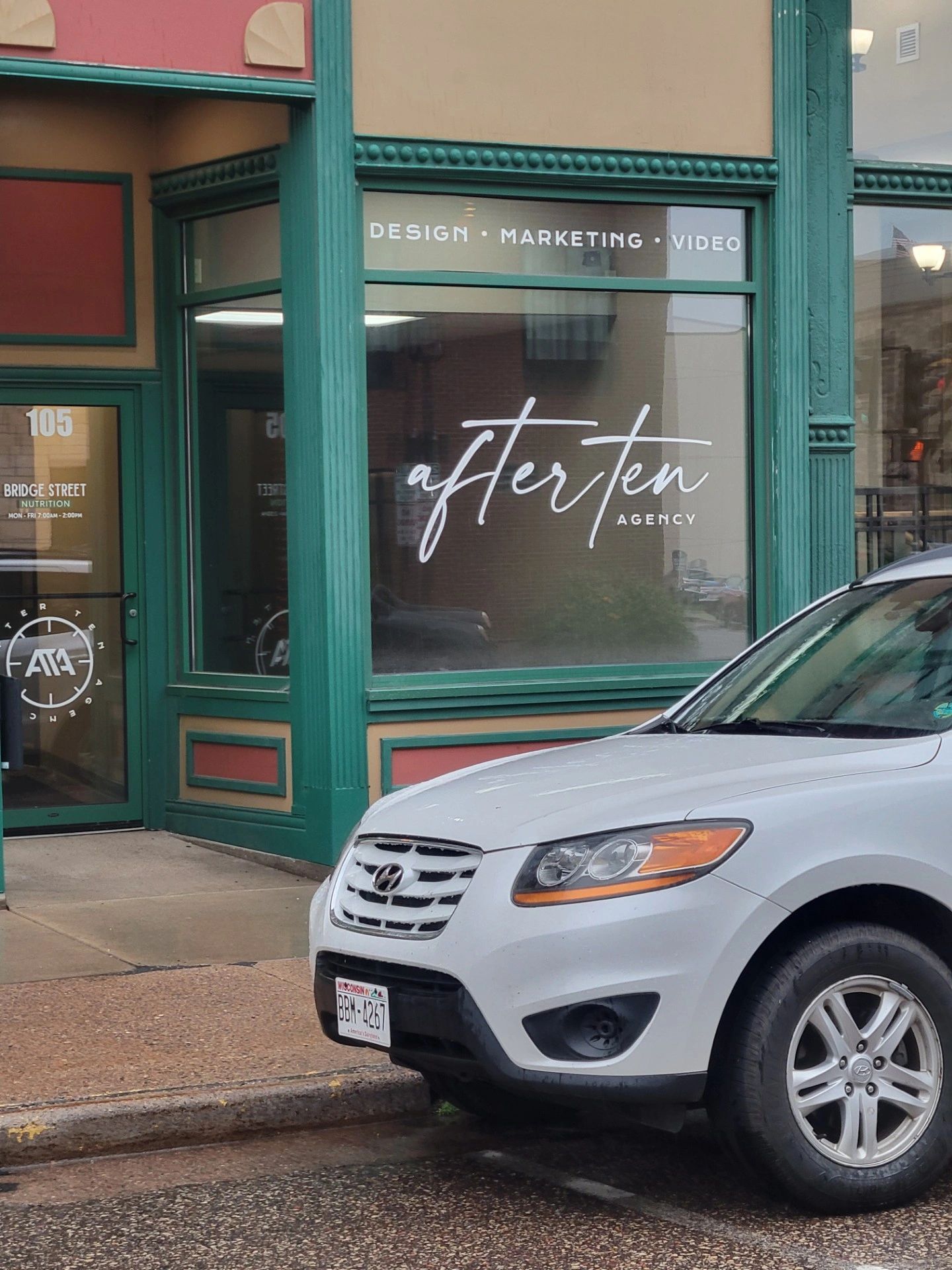 storefront with after ten agency signage
