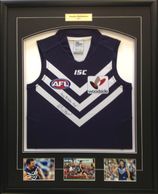 Fremantle Dockers sports shirt with a plaque and photos