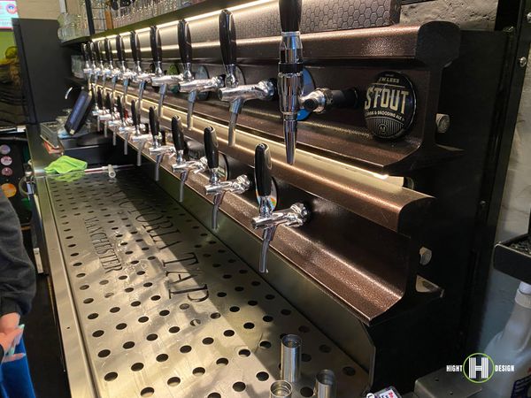 photo of beer taps mounted on railway track