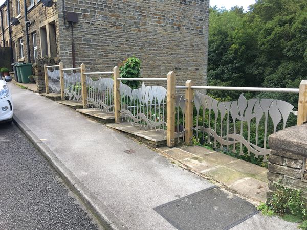 photo of ornate plasma cut fence panels