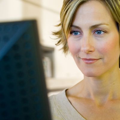 Woman looking at a computer monitor