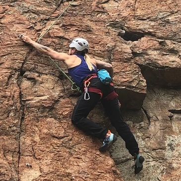 Woman rock climbing in Squamish, BC.
