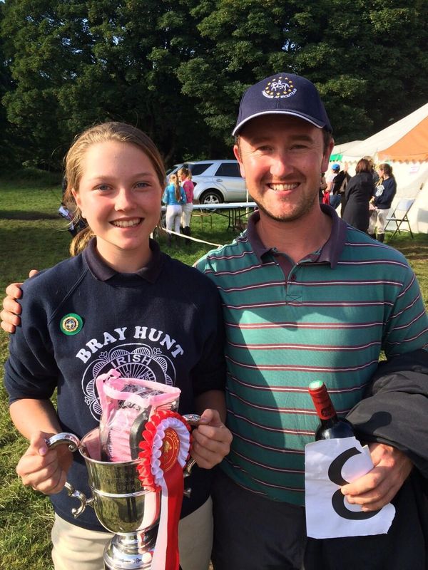 Tilly with one of her Pony Club coaches holding the Showjumping Member Cup of the Year. Summer 2014