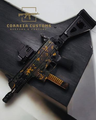 Sub-machine gun with gold and dark green camo Cerakote coating