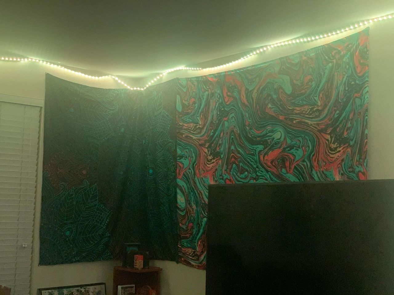 Having colorful lights and cool tapestries as a background can add POP to your stream