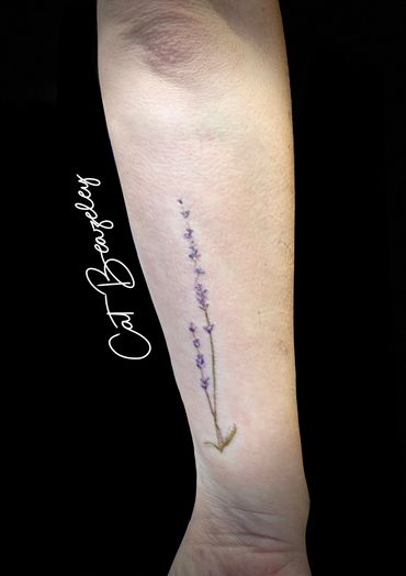 Super cute, soft and delicate lavender tattoo by Car Beazeley tattoo in full colour 