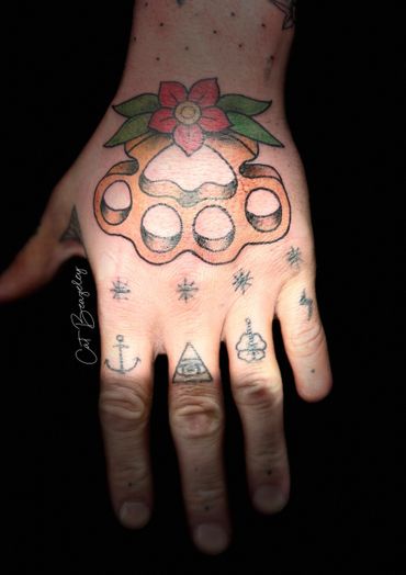 Neo traditional knuckle duster hand tattoo by Cat Beazeley Tattoo
