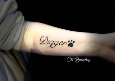 Script tattoo and paw print by Cat Beazeley Tattoo 