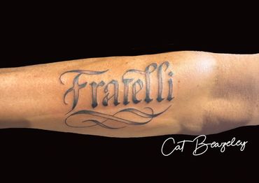 Fratelli script tattoo - Italian text tattooed by Cat Beazeley