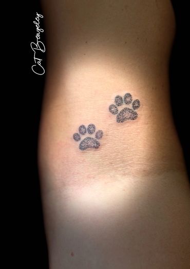 Cute paw print tattoo by Cat Beazeley tattoo 