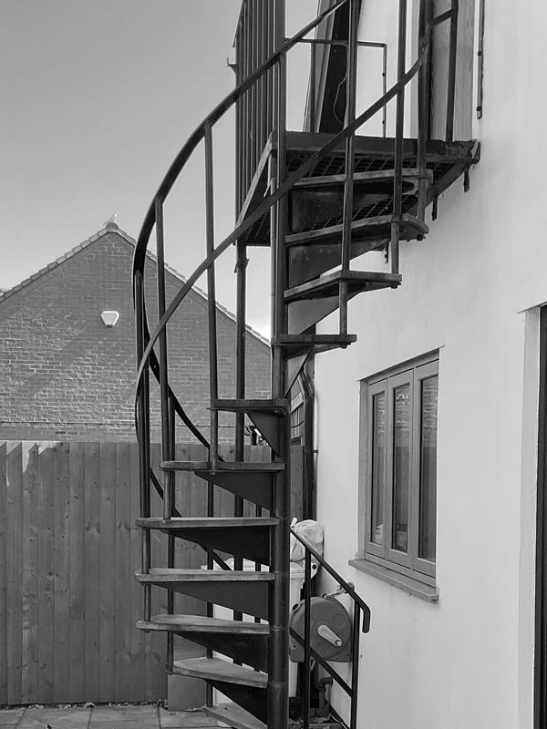 Spiral staircase showing access to the studio space 