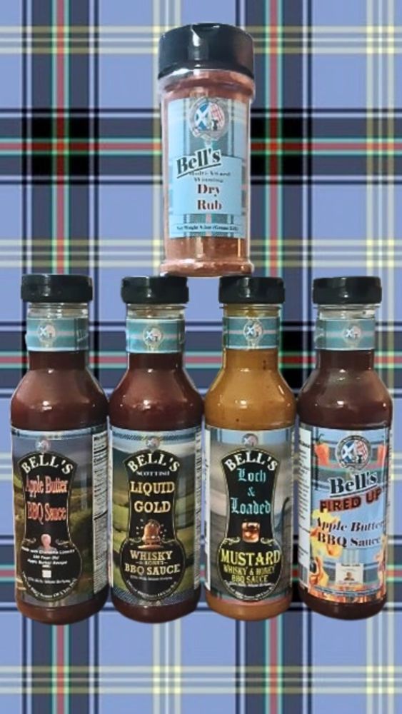 Variety of Bell's BBQ sauces and dry rub on a plaid background.