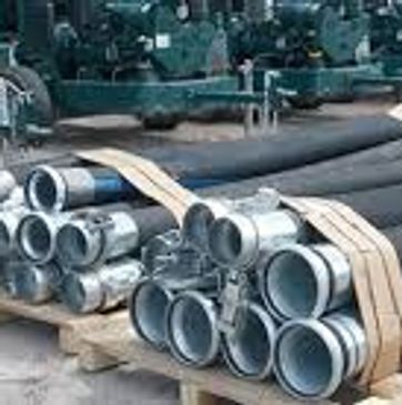 Stacked metal pipes with fittings secured on wooden pallets.