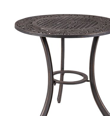 Round metal table with intricate lattice design and curved legs.