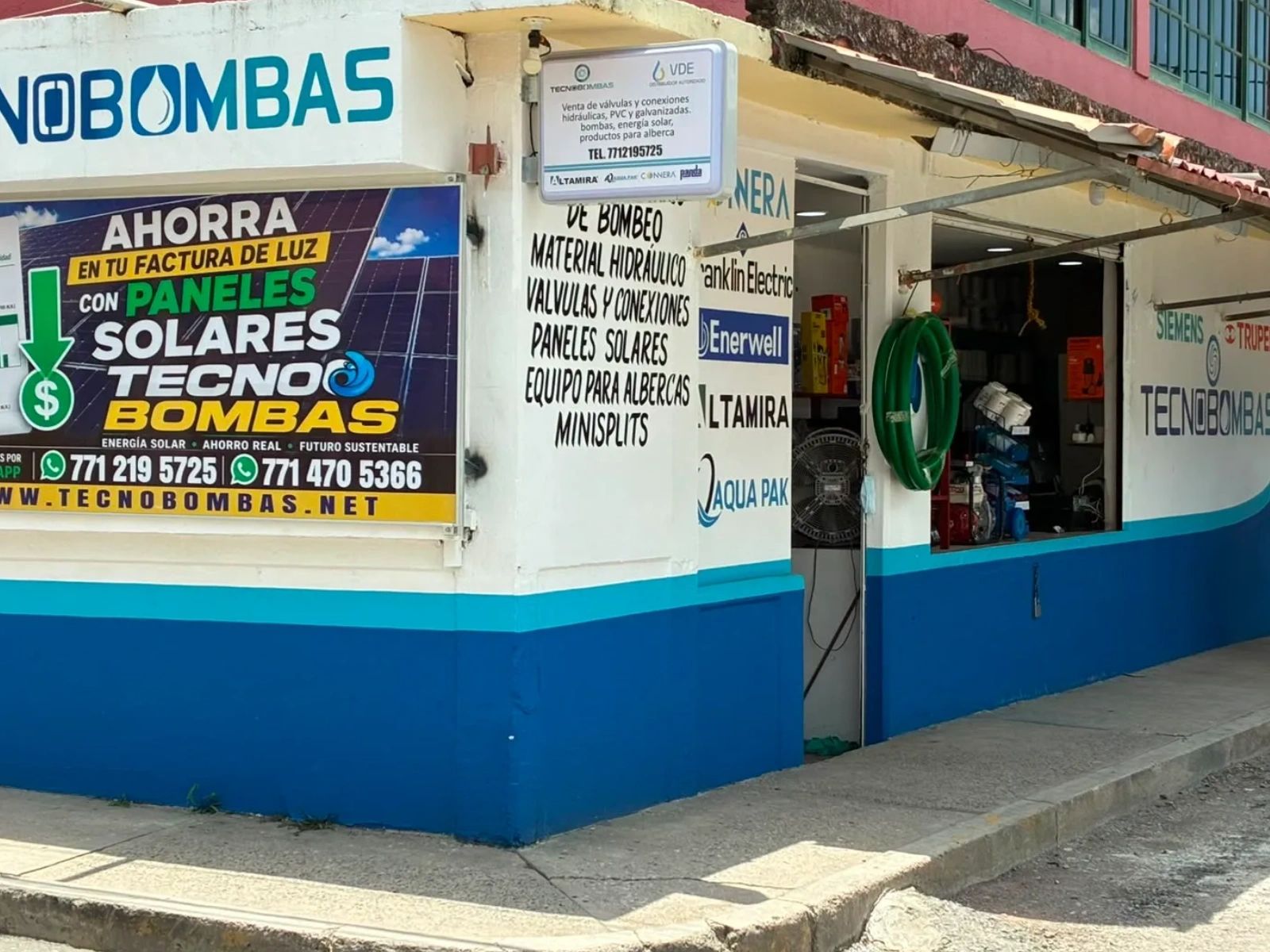 Storefront of Tecnobombas selling solar panels and hydraulic equipment.