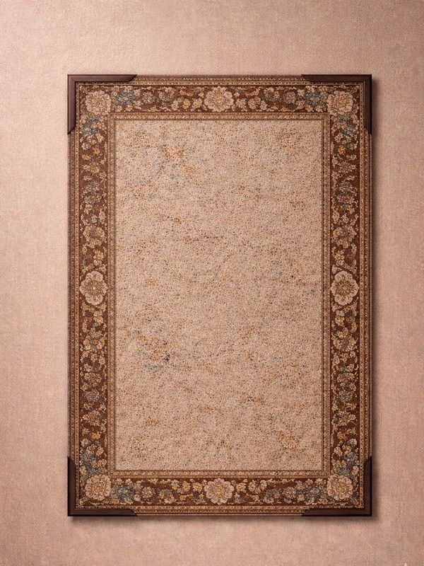 A framed intricate Persian-style carpet with floral patterns hangs on a matching wall.