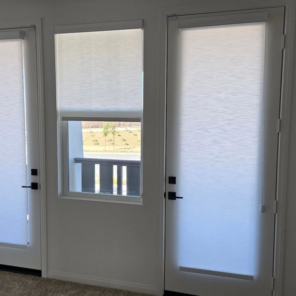 Porto White light filtering roller shades 