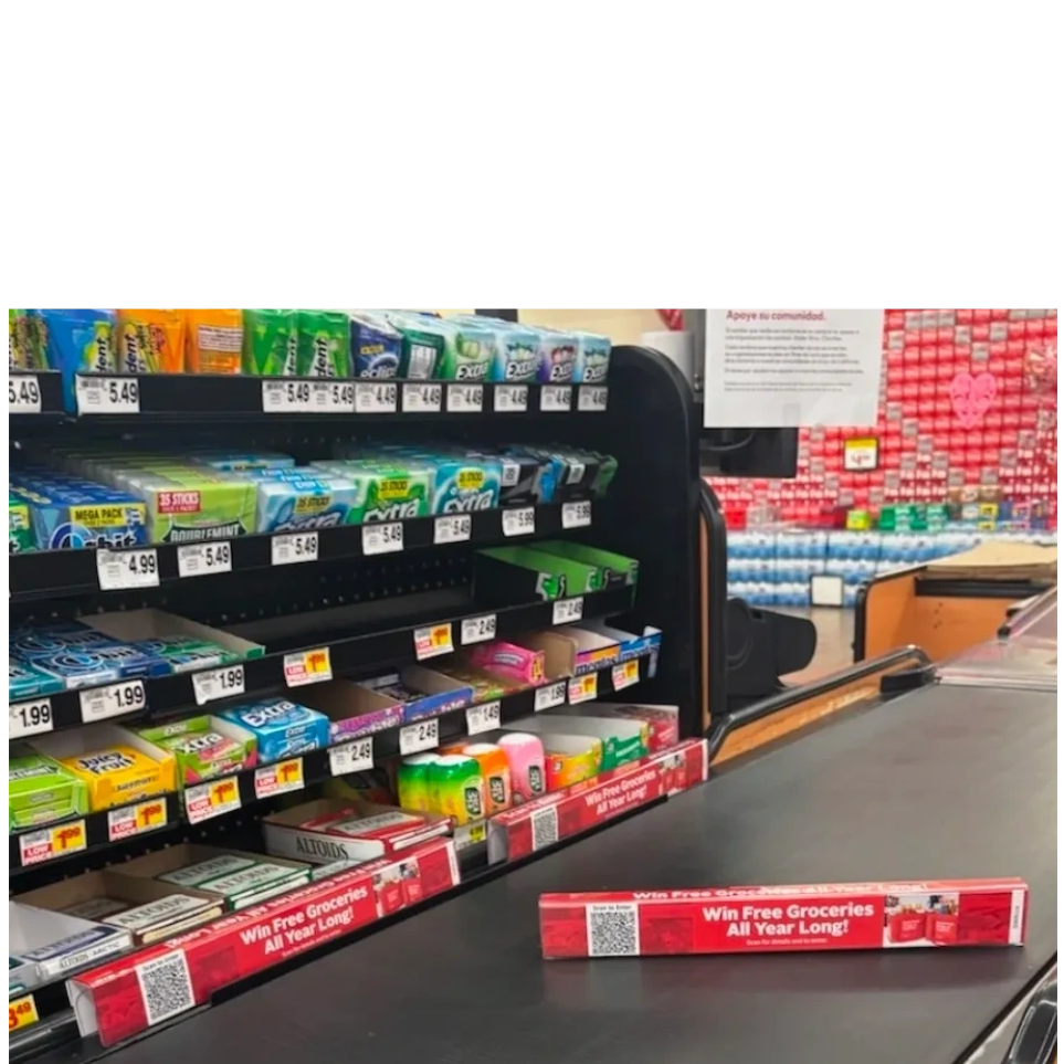 Digital grocery checkout advertising display.