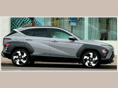 Side view of a modern gray SUV parked on the street.