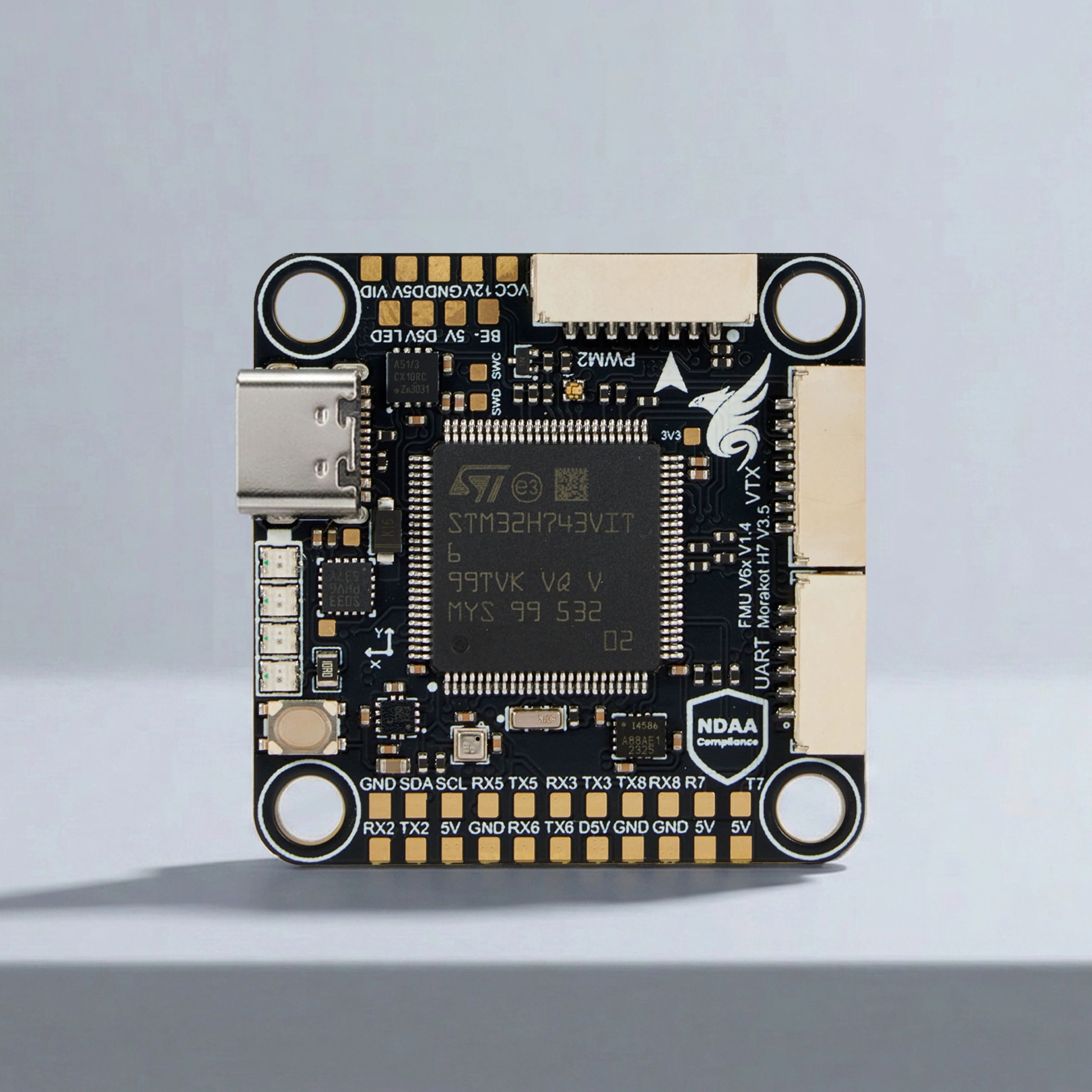 Close-up of a microcontroller board with a USB-C port and multiple connectors.