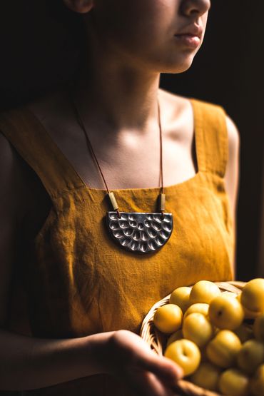 Hand carved primitive necklace brass ceramics clay leather small batch maker gold  Linda Coss 